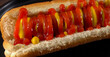 Hot Dog Barbecue Grilled with Yellow Mustard and Ketchup, minimal close up. Hot dog freshly baked on plate, homemade. Grocery product advertising, menu or package, selective focus.