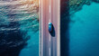 © AngrySun - Aerial view of car driving on asphalt highway road near the ocean. Sun shine. Travel concept. Generative AI
