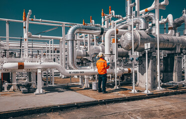 Canvas Print - Male worker inspection exchanger afternoon of tank oil refinery pipeline plant steam vessel and column tank oil