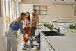 © Stockphotodirectors - Female shop assistant helping young couple choose new dishwasher