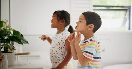 Wall Mural - Siblings, learning or children in bathroom brushing teeth together for development in morning at family home. Boy, girl or kids cleaning mouth with toothbrush for dental or oral health for wellness