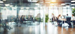 © chiew - Business office with blurred people. Abstract light bokeh at office interior background for design.
