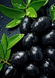 Fototapeta Storczyk - Many fresh and ripe black olives with detailed water drops, bio farm food concept. Generative Ai.