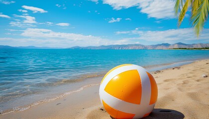 Wall Mural - beach ball on a tropical sandy beach during summer. Beach ball in sand. Summertime vacation with clear blue water and the sun