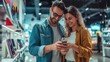 © Oulaphone - Happy couple buying a smartphone in store. New digital device concept.