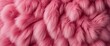 Pink fur texture top view. Pink sheepskin background. Fur pattern. Texture of pink shaggy fur.