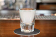 Ouzo or raki - traditional balkan anise strong alcoholic drink on bar counter close-up.