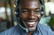 a man wearing a headset smiling