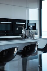 Sticker - A contemporary kitchen featuring sleek black and white appliances. Perfect for showcasing a modern and minimalist aesthetic. Ideal for home decor, interior design, and kitchen renovation projects