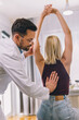 © Mediteraneo - Chiropractor treating a young woman as a patient in his office.