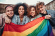 vibrant group of young adults joyfully holding a rainbow pride flag, symbolizing LGBTQ solidarity and diversity