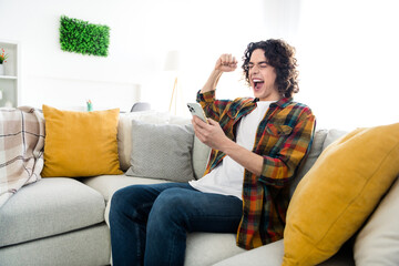 Sticker - Photo of cool funky guy dressed checkered shirt online sale shopping modern gadget rising fist indoors house home room