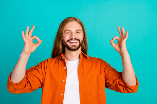 portrait of young optimistic blond hair guy loves christianity religion showing two okey symbols iso