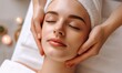 © TheoTheWizard - Beautiful young woman having a facial massage at the spa salon. Beauty treatment concept.