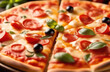 © Олеся Касумова - Delicious pizza cut into pieces in close-up.Food and snacks
