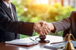 © RCH Photographic - Two Businessman shaking hands at anoffice meeting closeup handshake friendly welcome introduction and greeting between two future business partners welcoming handshake gesture