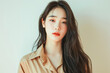 © Jira - Chinese woman in a studio portrait exuding beauty, glamour, and sensuality with her stylish makeup, fashionable long hairstyle