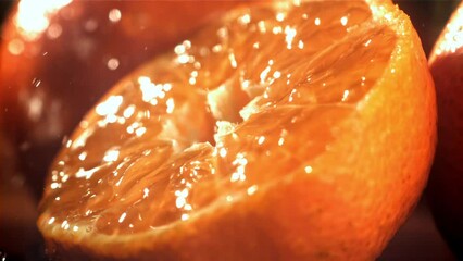 Poster - Raindrops drip on a fresh tangerine. Filmed on a high-speed camera at 1000 fps. High quality FullHD footage