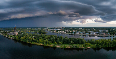 Wall Mural - Thunderstorm over Riga. Huge thunderstorm dark clouds over the city of Riga