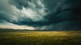 Fototapeta  - Rainfall in the distance on the prairies under ominous storm clouds