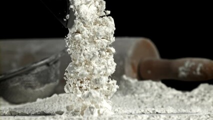 Poster - Flour falls on the kitchen table. Filmed on a high-speed camera at 1000 fps. High quality FullHD footage