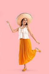 Poster - Dancing woman in sombrero hat on pink background