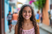 A Young Girl In A Pink Tank Top Smiles For The Camera