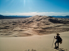 Hiker Crossing The Mohave Desert 