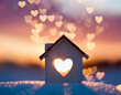 © alionaprof - Miniature house with heart shape window on sunset background. Sweet home concept. Family warmth, love and protection