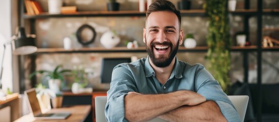 Poster - Smiling bearded man celebrates successful work deal with good news, near laptop.