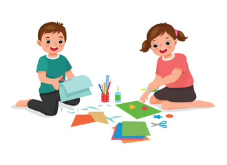 Canvas Print - Cute little kids cutting paper making art sitting on the floor together