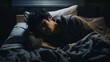 © Tahsin - A despondent Asian young man, unable to sleep, lies in bed amid shaggy sheets