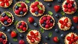 Colorful berry tartlets or cake for kitchen pattern. Pastry dessert from above. Copy space for text.