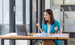 © David - Excited Happy asian woman sit at desk feel euphoric win online, happy asian woman overjoyed get mail at laptop being promoted at work, biracial girl amazed read good news at computer