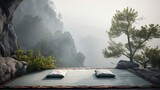 Fototapeta Natura - A peaceful misty rocky mountain landscape with trees with meditation mat and pillow