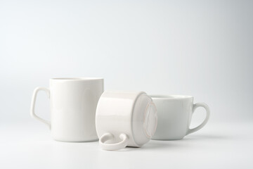 Wall Mural - Blank white mugs mock up on white background