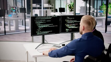Wall Mural - computer programmer writing program code on computer