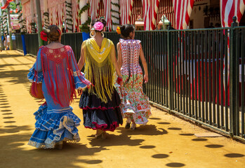 Wall Mural - the ladies with flamenco dress at the Andalusian folk festival