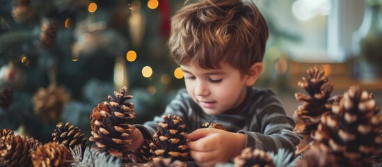 Poster - Child crafting pine cones into holiday decorations