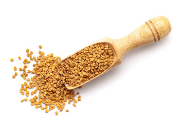 Wall Mural - Top view of Organic Fenugreek seeds (Trigonella foenum-graecum ) in a wooden scoop. Isolated on a white background.