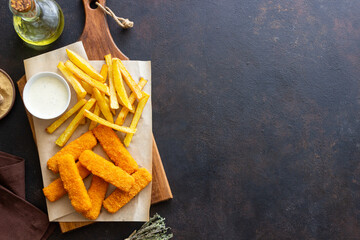 Fish fingers with french fries and white sauce. Sea food. Fish and chips.