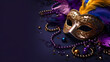 Mardi Gras venetian carnival mask  and beads on purple background , With jewelry and necklace