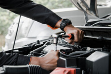 Mechanic Fixing A Car At Home. Repair And Service.