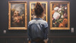 © Dominik - Woman viewing art in a gallery