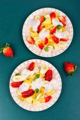 Canvas Print - Fruit salad with yogurt on a plate.