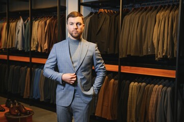 Wall Mural - Perfect to the last detail. Modern businessman. Fashion shot of a handsome young man in elegant classic suit