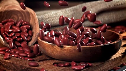 Poster - Bean grains fall into a wooden bowl. Filmed on a high-speed camera at 1000 fps. High quality FullHD footage