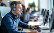 © Riccardo - middle aged man works in a call center with computer and headset