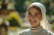 
A beautiful catholic young nun with a kind candid smile against the backdrop of a garden Temple