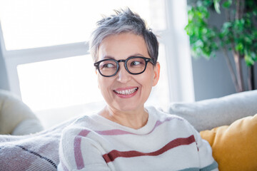 Sticker - Photo of dreamy shiny woman dressed striped sweater eyewear relaxing sofa indoors house home room